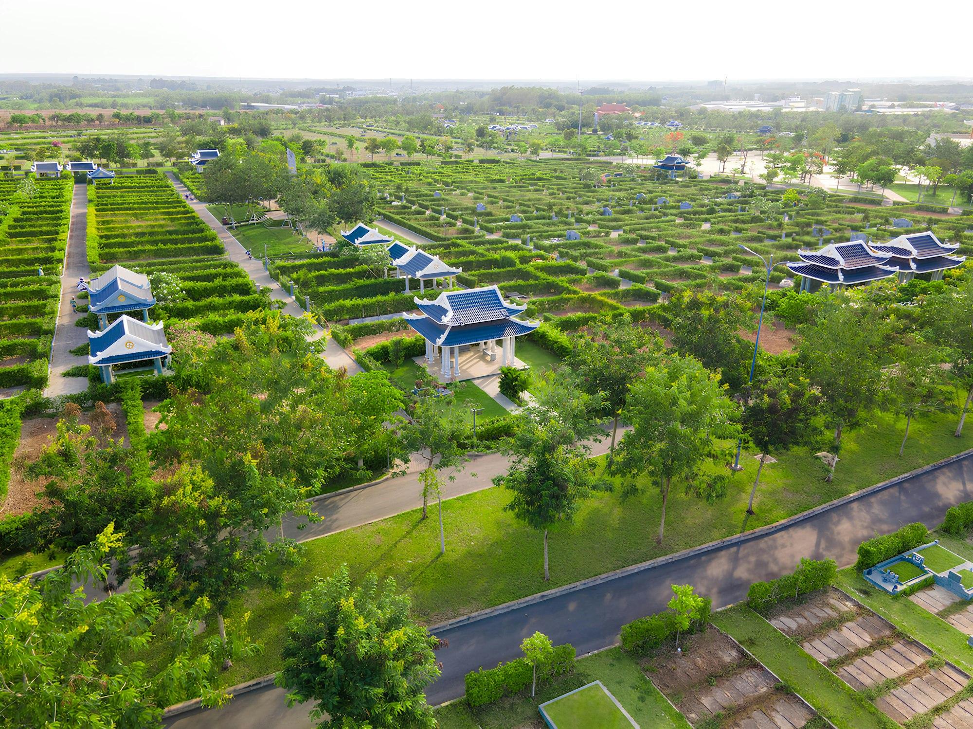 Aerial view of a landscaped residential estate showing open green space and tree cover